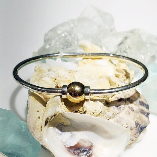 made on cape cod. bracelet made of 925 sterling silver and 14k gold